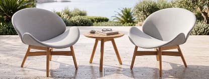 Two round outdoor chairs and table.