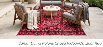 Outdoor furniture on red patterned rug. Image Text: Jaipur Living Polaris Chaya Indoor/Outdoor Rug