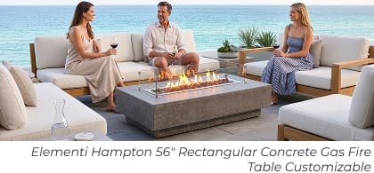 Friends seated around concrete fire table. Image Text: Elementi Hampton 56" Rectangular Concrete Gas Fire Table Customizable